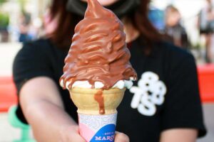 a woman holding ice-cream