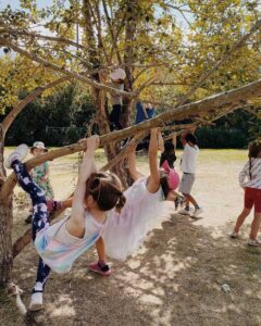 children playing under a tree